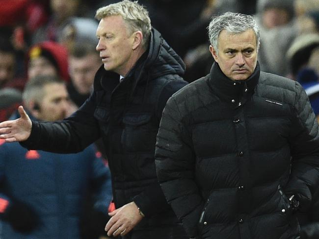 Manchester United's Portuguese manager Jose Mourinho (R)  with David Moyes.