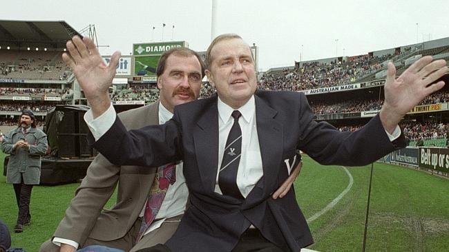 Ted Whitten with his son during a an emotional lap of honour at the MCG.