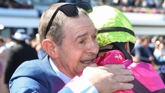 Robbie Dolan is embraced by his dad. Picture: Reg Ryan/Racing Photos via Getty Images