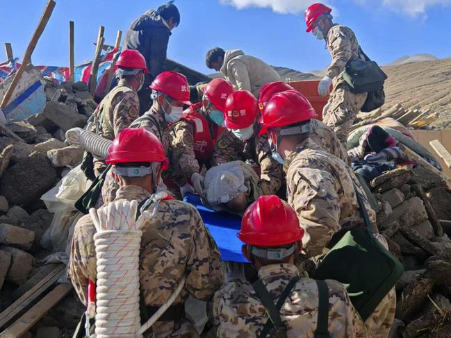 Frst responders perform rescue work at a village in Changsuo Township of Dingri County. Picture: Hu Zikui/Xinhua via AP