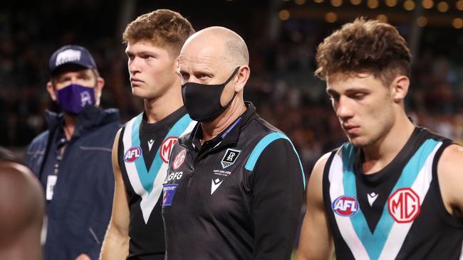 Port Adelaide coach Ken Hinkley walks off with his players after the Showdown loss. Picture: AFL Photos