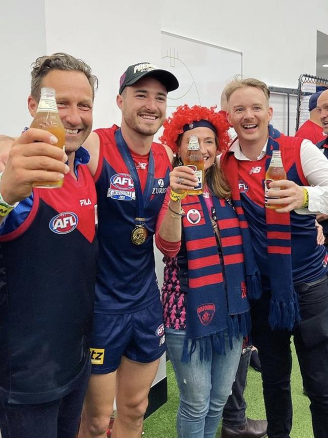 Hayden Burbank (left) celebrating with the Dees after their grand final win in Perth. Picture: Instagram