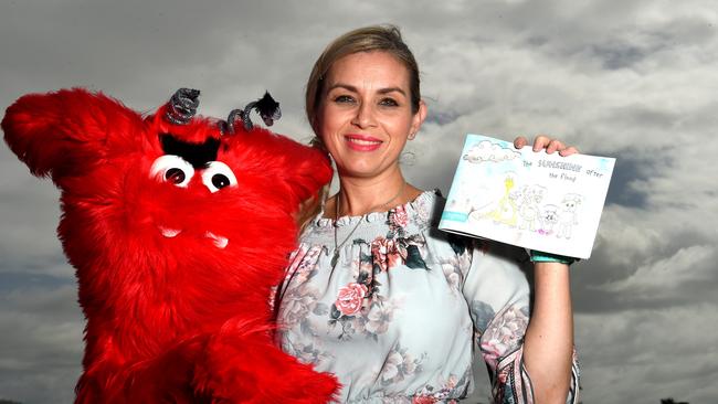 Townsville children's psychologist Carolyn Seri, with Ralphy, launched a children's book to help kids deal with the floods. Picture: Evan Morgan