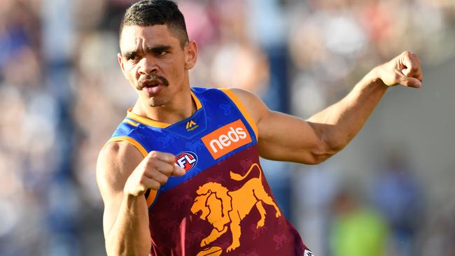 Charlie Cameron of the Lions celebrates kicking a goal.