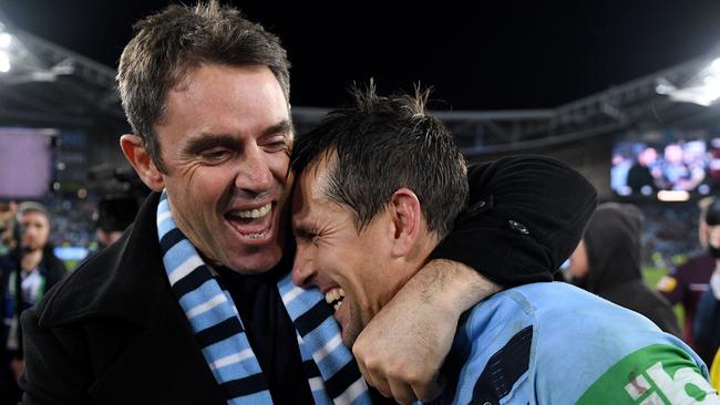 NSW Blues coach Brad Fittler celebrates with Mitchell Pearce following the Blues win.