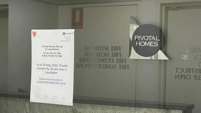 A notice out the front of a Pivotal Homes office informing the public they have gone into liquidation.