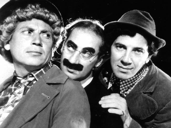 Microsoft screen saver image of The Marx Brothers, Harpo, Groucho and Chico in a handout photo.