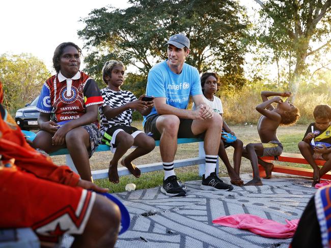 Cummins hanging out with the local kids after a game of football in Borroloola. Picture: Sam Ruttyn