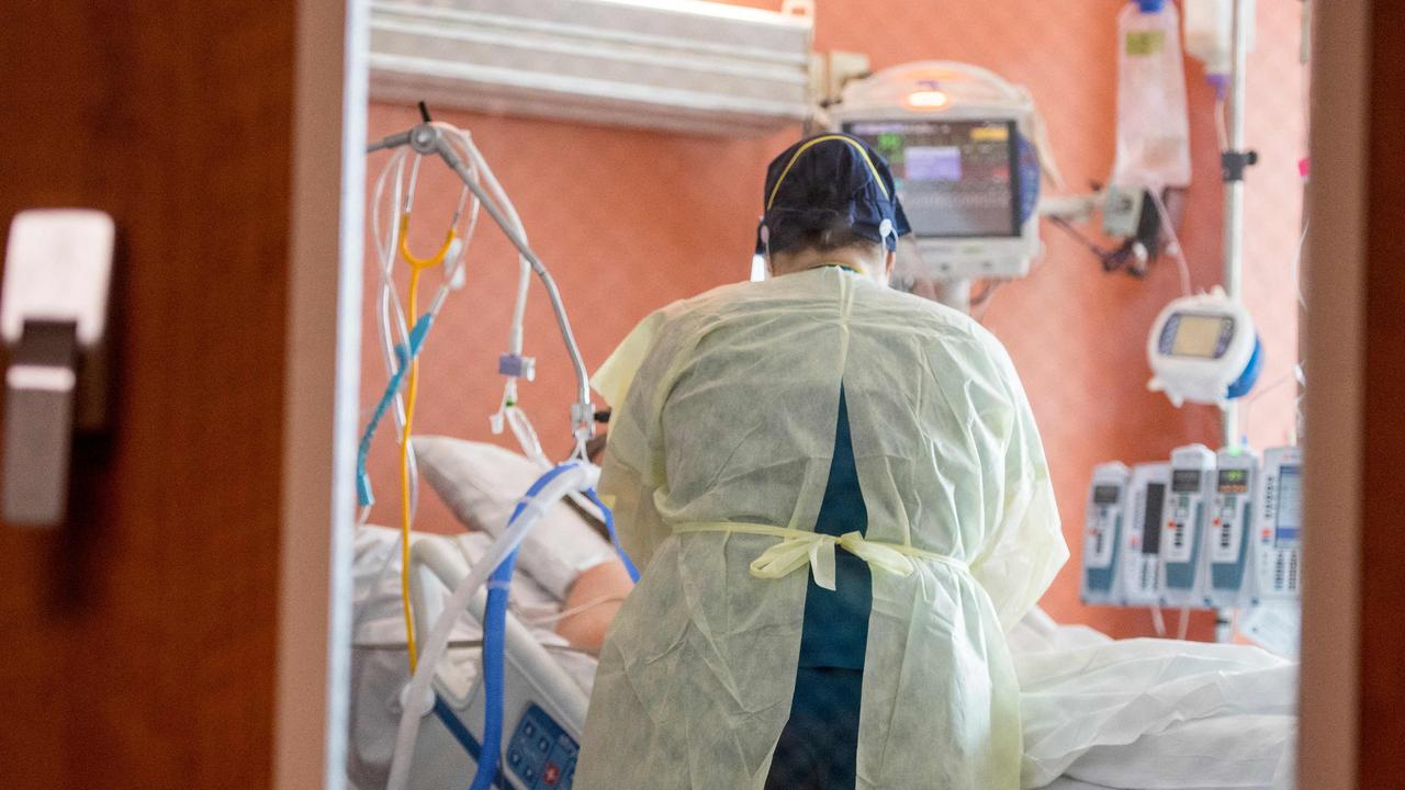 A nurse cares for a Covid-19 patient inside the ICU at Adventist Health in Sonora, California. In 27 days the hospital had 72 hospitalisation due to Covid-19 of which 11 have died from complications of the virus. Picture: Nic Coury/AFP