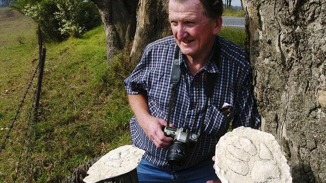 Cryptozoologist Rex Gilroy with paw print castings in Appin. Picture: Ian Svegovic