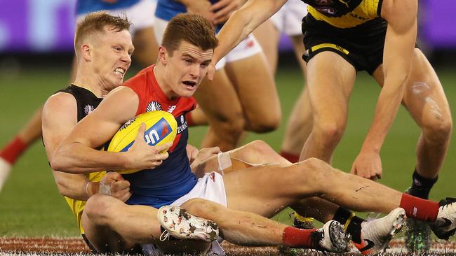 Jack Riewoldt brings Bayley Fritsch to the ground in a tackle. Picture: Getty Images