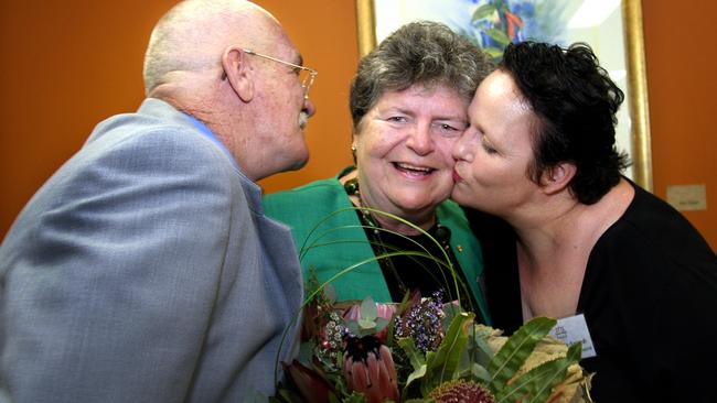 Leneen Forde receives a hug from former abuse victims Alan Allaway and Beth Wilson-Szoredi at the opening of Lotus Place a one stop shop for the victims of abuse in institutions in May 2006. The centre was a recommendation of the Forde Inquiry. Picture: Grant Parker