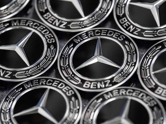 (FILES) In this file photo taken on February 4, 2019 Mercedes stars are stored to be fixed on wheels of Mercedes Benz A Class cars near the assembly line at the Daimler AG factory in Rastatt, southwestern Germany. - German car giant Daimler said on September 24, 2019 it will not contest an order from Stuttgart prosecutors to pay an 870 million euro ($957 million) fine over tens of thousands of diesel vehicles that breached emissions rules. (Photo by THOMAS KIENZLE / AFP)