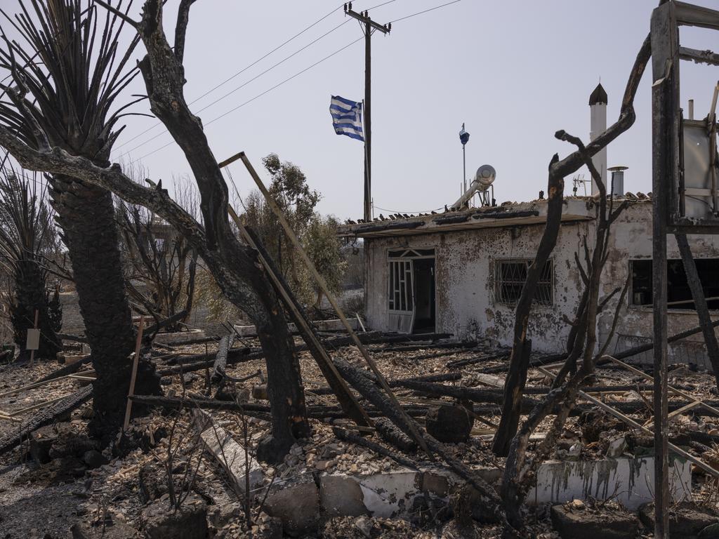 The burnt out Angelika Taverna in Kiotari, Rhodes, Greece. The fires on Rhodes prompted preventive evacuations of tens of thousands of tourists. Picture: Getty Images