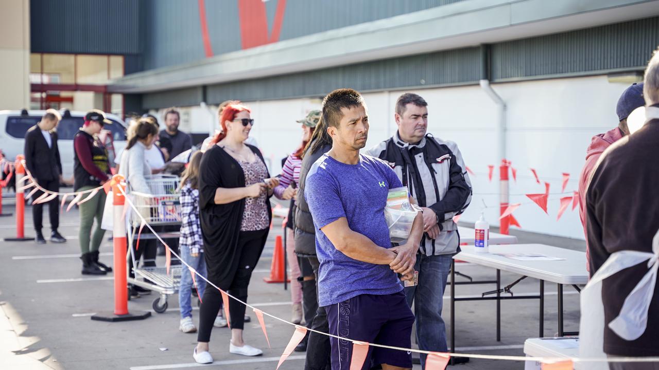 People queue up for sausages earlier this year. Picture: Mike Burton