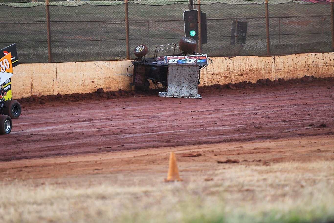 Maryborough Speedway Round One - Ken Newton climbs the wall after losing control on the slippery track. Picture: Cody Fox