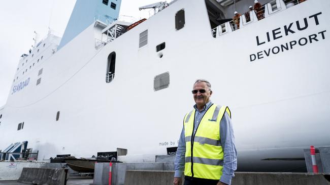 Executive chairman of SeaRoad Chas Kelly in front of the soon to be replaced MV Liekut. Pic: supplied.