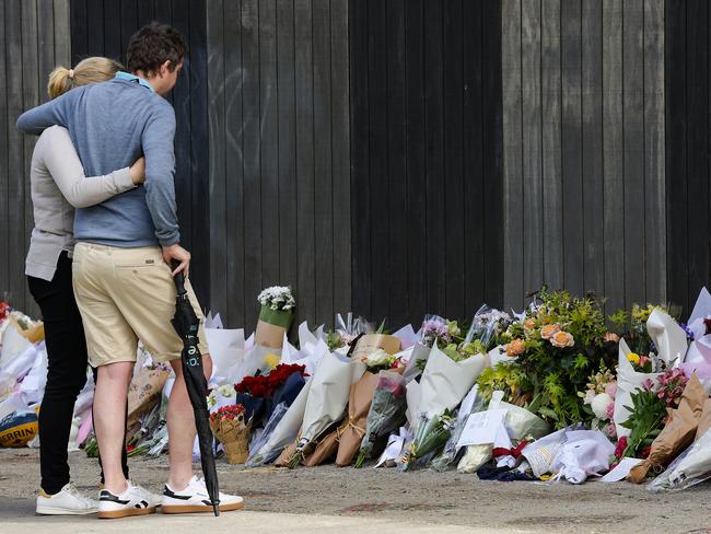 People gather outside Auburn South Primary School on Thursday. Picture: Ian Currie