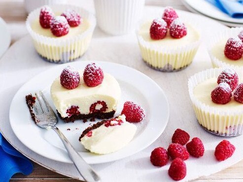 Mini raspberry and white chocolate cheesecakes.