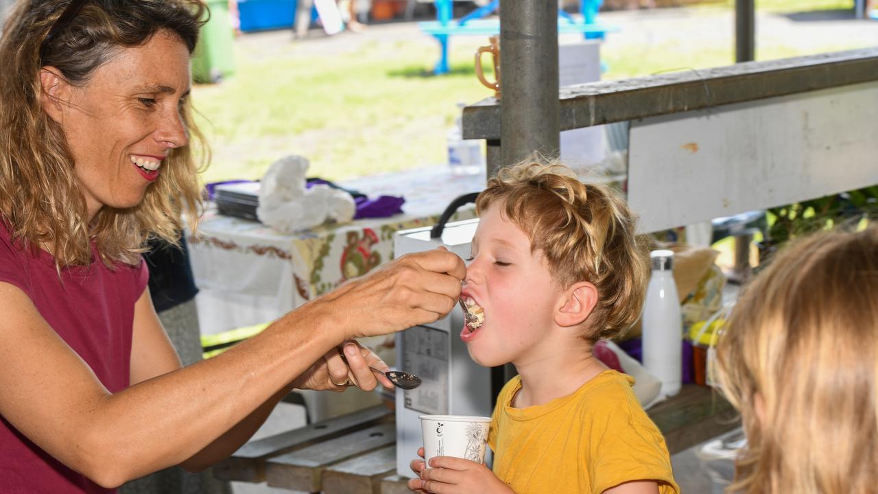 Mum Jade Page giving her son Ruben Podd a taste at the Lismore Farmers Markets.