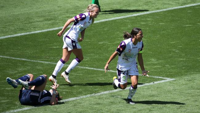 Perth striker Sam Kerr, right, celebrates a goal against Melbourne Victory in their W-League semi-final at AAMI Park last Sunday. Picture: AAP
