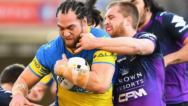 Tepai Moeroa is tackled during the Storm v Eels clash in Melbourne.