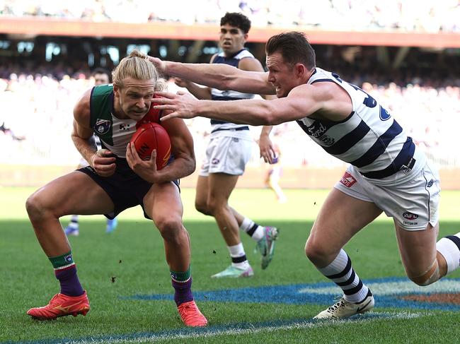 PERTH, AUSTRALIA - AUGUST 10: Patrick Dangerfield of the Cats tackles Corey Wagner of the Dockers during the round 22 AFL match between Fremantle Dockers and Geelong Cats at Optus Stadium, on August 10, 2024, in Perth, Australia. (Photo by Paul Kane/Getty Images)