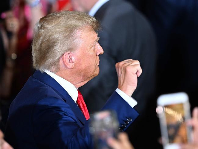 Donald Trump makes a fist as he arrives to speak at his Mar-a-Lago estate in Palm Beach. Picture: AFP