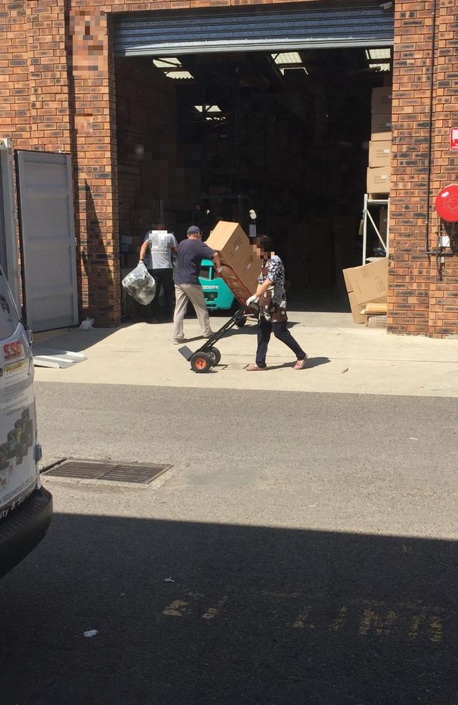 Wei Zhang (centre) and staff members unload an earlier consignment of Chinese-made plush toys after a container load was delivered on January 22. Picture: PFM