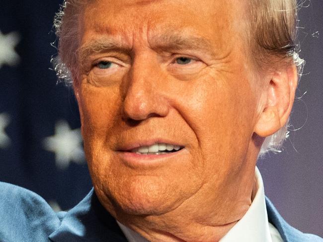 TOPSHOT - US President-elect Donald Trump gestures while speaking during a meeting with House Republicans at the Hyatt Regency hotel in Washington, DC on November 13, 2024. (Photo by Allison ROBBERT / POOL / AFP)