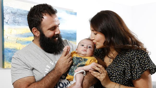 Mira Abunucerah Haddad, husband Daniel Haddad and their baby Thomas, who was born by surrogate in Canada. Picture: Jonathan Ng