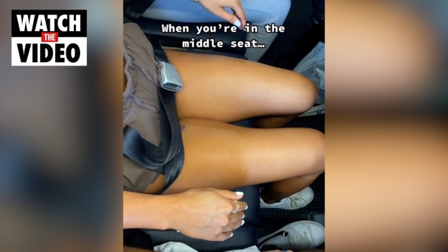 Woman's middle seat plane act divides