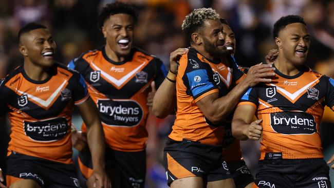 SYDNEY, AUSTRALIA - AUGUST 22: Latu Fainu of the Wests Tigers celebrates scoring a try during the round 25 NRL match between Wests Tigers and Manly Sea Eagles at Leichhardt Oval on August 22, 2024 in Sydney, Australia. (Photo by Jason McCawley/Getty Images)