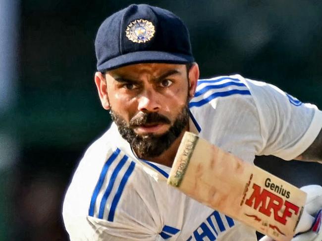 India's Virat Kohli watches the ball after playing a shot during the fourth day of the second Test cricket match between India and Bangladesh at the Green Park Stadium in Kanpur on September 30, 2024. (Photo by Money SHARMA / AFP) / -- IMAGE RESTRICTED TO EDITORIAL USE - STRICTLY NO COMMERCIAL USE --