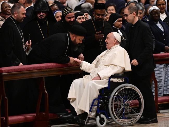 Pope Francis greets faithful as he arrives to lead the vespers at St Peter's basilica in The Vatican, on February 1, 2025. (Photo by Tiziana FABI / AFP)