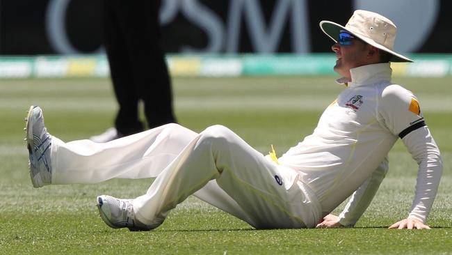 Australia's Michael Clarke reacts after injuring himself during the final day of their cricket test match against India in Adelaide, Australia, Saturday, Dec. 13, 2014. (AP Photo/James Elsby)