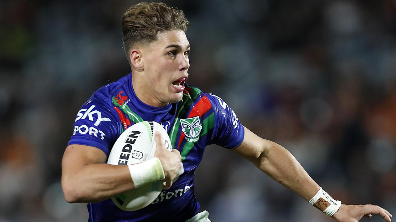 GOSFORD, AUSTRALIA - MAY 21: Reece Walsh of the Warriors makes a break during the round 11 NRL match between the New Zealand Warriors and the Wests Tigers at Central Coast Stadium on May 21, 2021, in Gosford, Australia. (Photo by Mark Metcalfe/Getty Images)