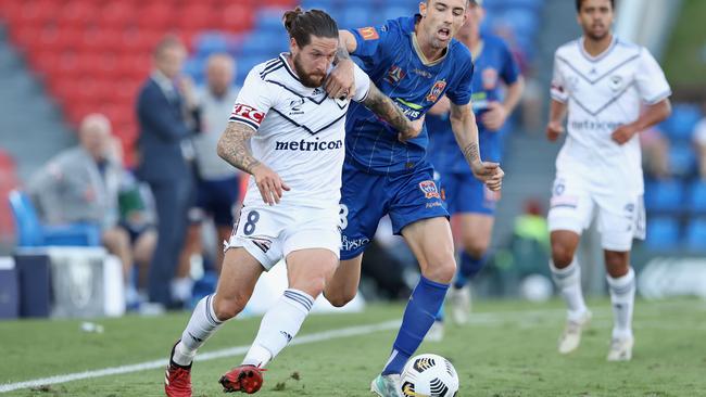 Jacob Butterfield, left, of Melbourne Victory contests the ball against Jason Hoffman of the Jets during the A-League match on Saturday. Picture: Ashley Feder/Getty Images