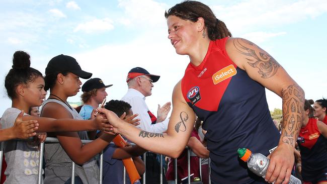 Young fans line up to high five Richelle Cranston of the Demons after their victory over the Adelaide Crows this weekend. (Pic: Michael Dodge/Getty)