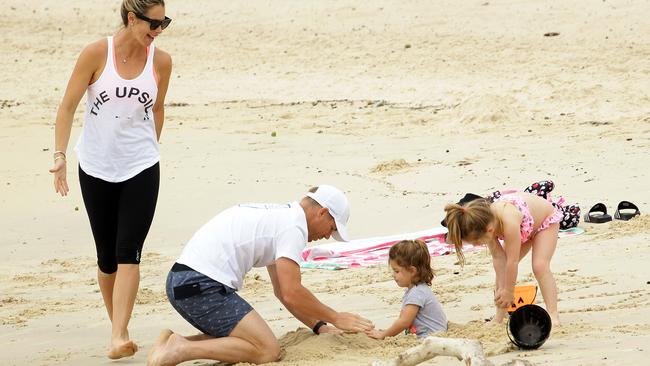 David Warner and wife Candice are seen relaxing with their children at Coogee Beach in Sydney. Picture: Matrix