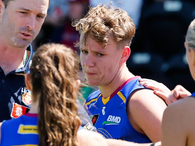 MELBOURNE, AUSTRALIA - NOVEMBER 03: Dakota Davidson of the Lions is seen being consoled by teammates at 3/4 time during the 2024 AFLW Round 10 match between Euro-Yroke (St Kilda Saints) and the Brisbane Lions at RSEA Park on November 03, 2024 in Melbourne, Australia. (Photo by Dylan Burns/AFL Photos via Getty Images)