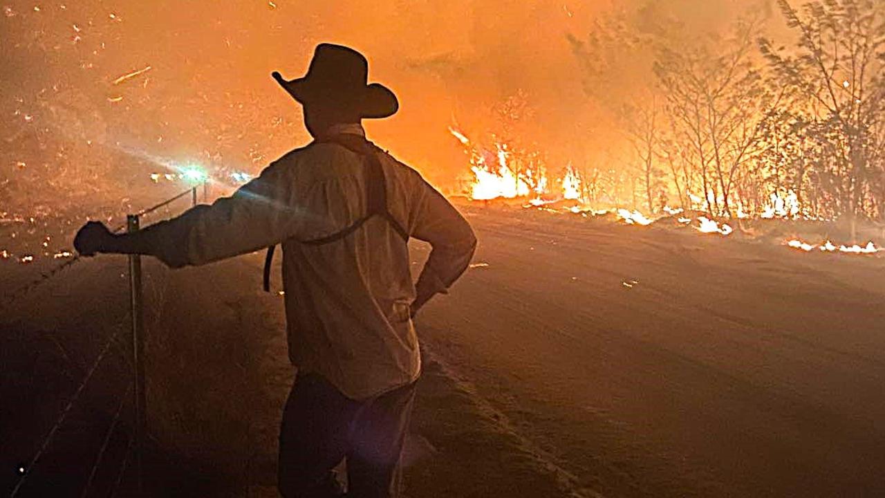 A volunteer firefighter labelled simply ‘Poster Boy’ takes a break during efforts to contain monster fire that has consumed 1200 hectares of outback bush west of Townsville in just two weeks. Picture: Torrens Creek Rural Fire Brigade