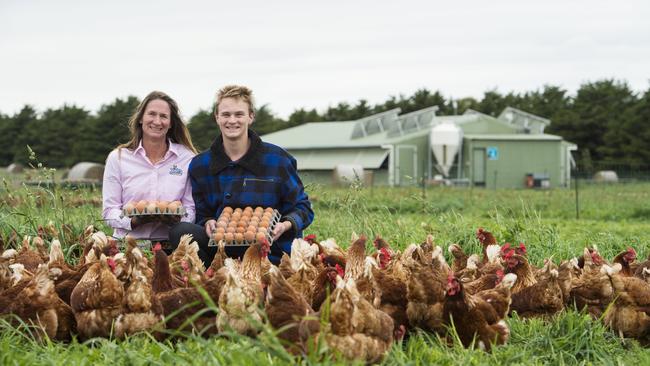 Clucky charm: Tamsyn and Josh Murray with their hens at Monegeetta in the Macedon Ranges. Picture: Zoe Phillips