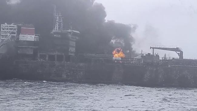 Rscue crews work on site after a cargo ship was hit by a tanker carrying jet fuel for the US military. Picture: Denys Mezentsev via AP