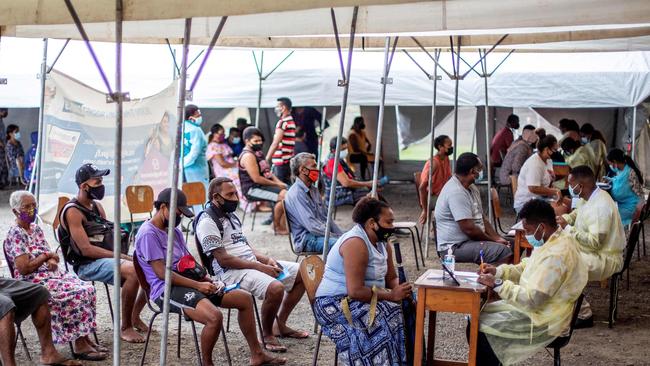 People wait in queue for their first dose of the AstraZeneca Covid-19 vaccine in Suva.