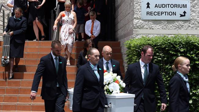 Mother Simone Tickle and brother Cody walk behind the casket of Blake Tickell.