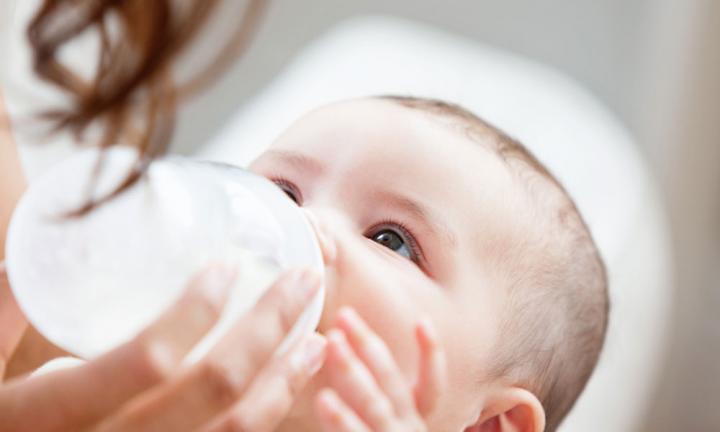 baby drinking milk from bottle