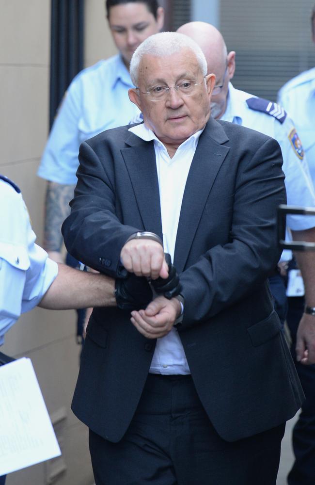 Not looking so flash... Ron Medich is led from court in handcuffs. He’s been convicted over Michael M<span id="U634238135537hoD" style="font-size:18pt;">c</span>Gurk’s murder. Picture: Jeremy Piper