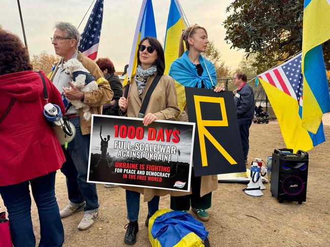 Pro-Ukrainian activists demonstrate in front of the White House in Washington, DC, on November 17, 2024. US President Joe Biden has cleared Kyiv to use long-range American missiles against military targets inside Russia, a US official told AFP on Sunday, hours after Russia targeted Ukraine's power grid in a deadly barrage. Ukrainian President Volodymyr Zelensky has long pushed for authorisation from Washington to use the powerful Army Tactical Missile System, known by its initials ATACMS, to hit targets inside Russia. (Photo by Daniel SLIM / AFP)