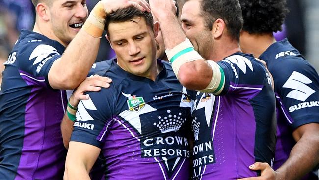 Cooper Cronk celebrates a Storm try.